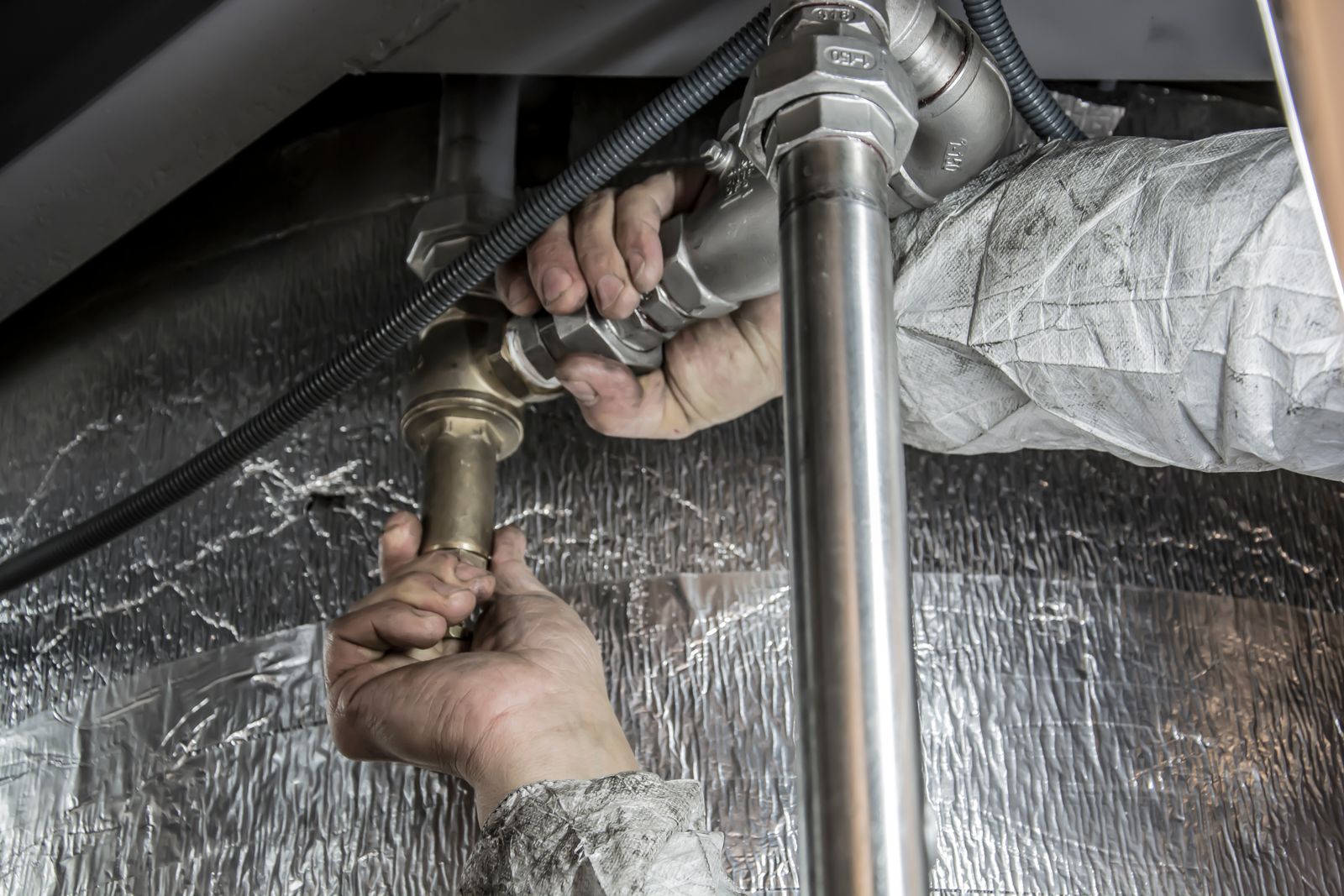 Plumber fitting steel pipework